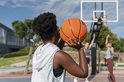 Freepik - side-view-female-friends-playing-basketball